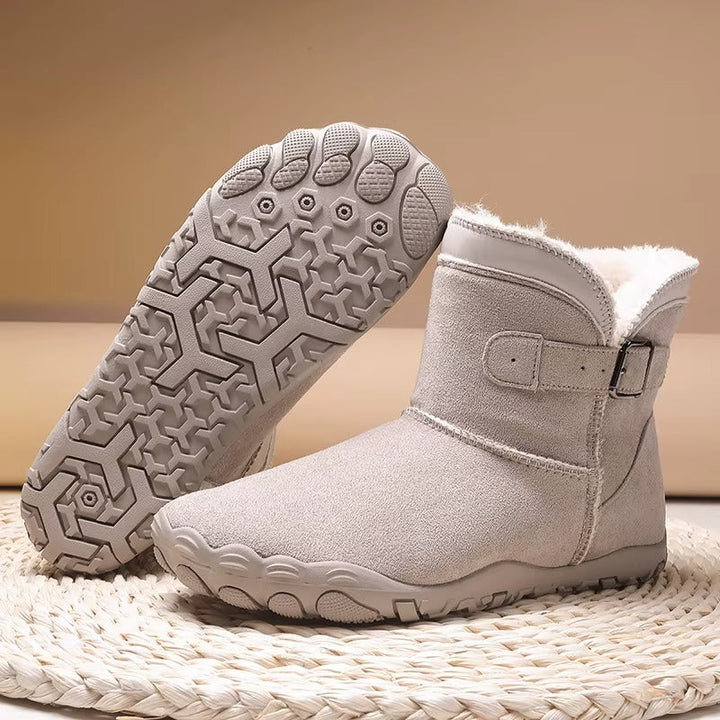 Cozy midnight black barefoot winter boots for men & women, featuring a roomy toe box & flexible sole.