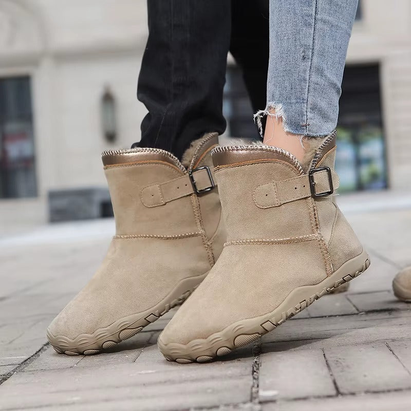 Close-up of cozy interior lining of warm barefoot winter boots, emphasizing comfort and warmth.