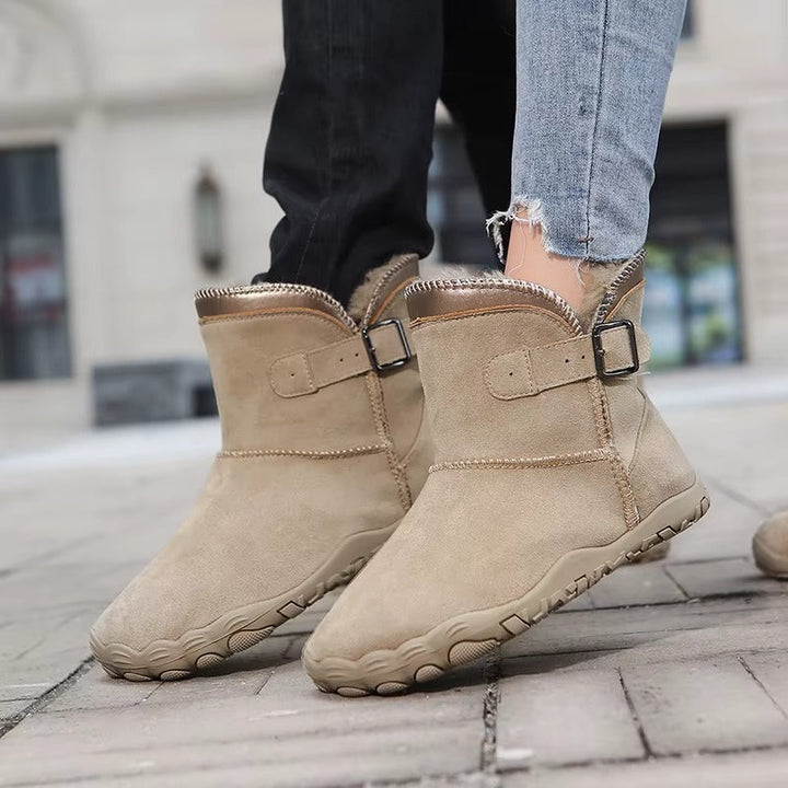 Close-up of cozy interior lining of warm barefoot winter boots, emphasizing comfort and warmth.