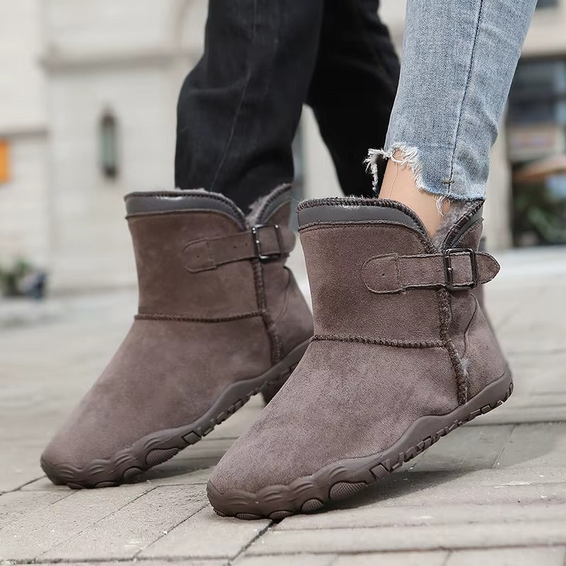Side profile of chestnut brown unisex barefoot boots, highlighting minimalist design & flexible sole.