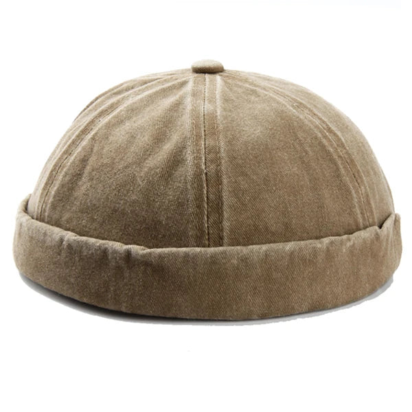Stylish unisex brimless cotton cap with a washed finish, perfect for casual fashion. Adjustable fit.