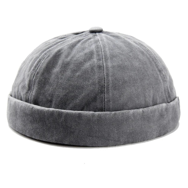Trendy unisex brimless cotton cap, washed for a unique look. An adjustable fashion accessory.