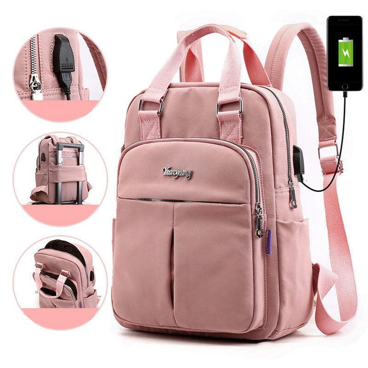 Water-resistant anti-theft backpack sitting on a desk with a laptop inside
