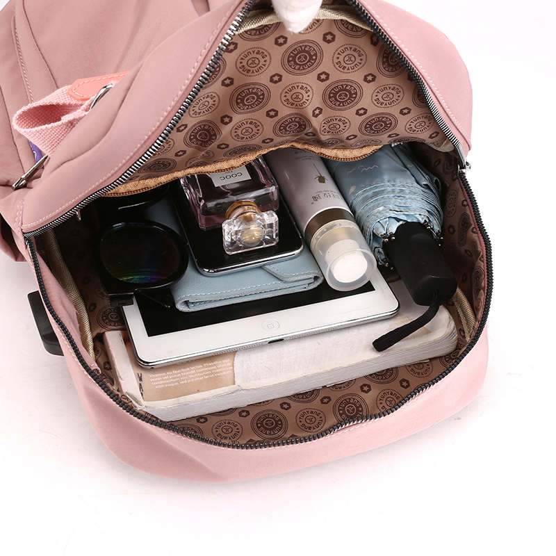 Back panel of anti-theft backpack showing padded straps and hidden pocket