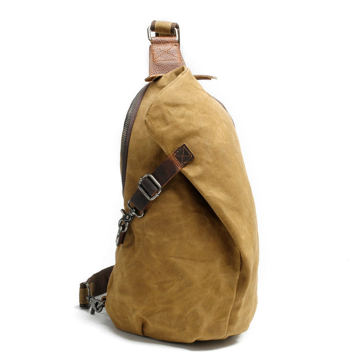 Active person wearing a unisex water-resistant canvas crossbody bag. Secure anti-theft design for on-the-go.