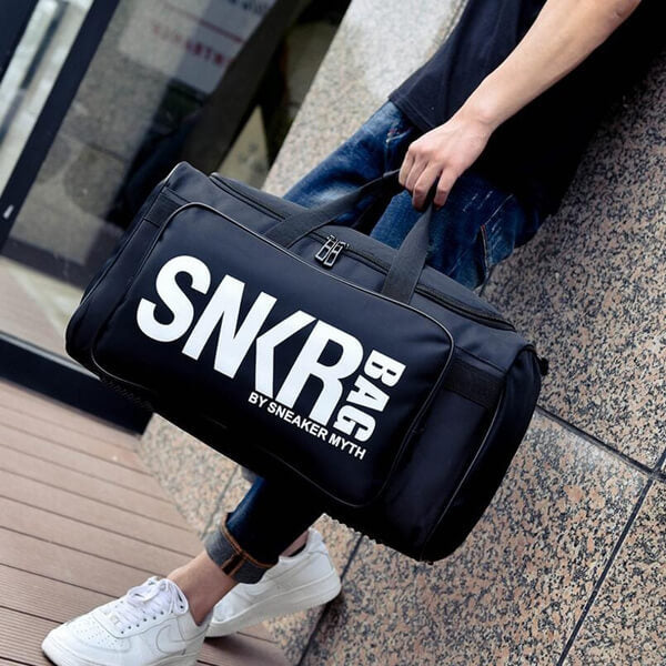 Unisex water-resistant sneaker & gear travel bag, black, front view, for active lifestyle