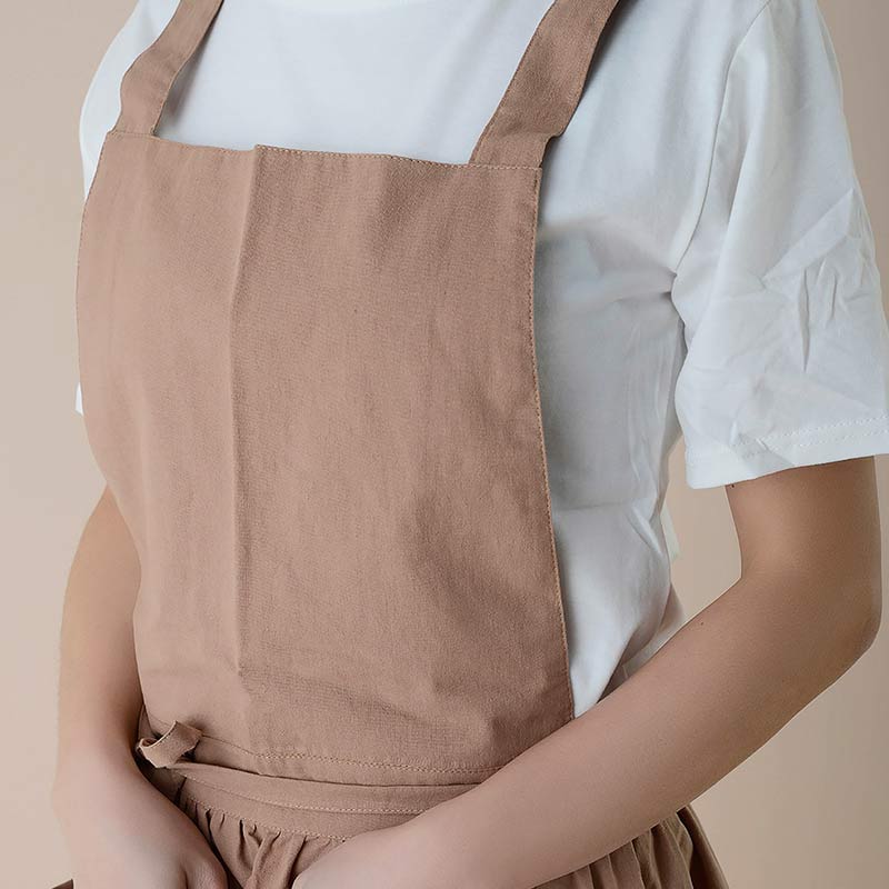Comfortable cotton cooking apron, waterproof, offering hands-free storage with pockets.