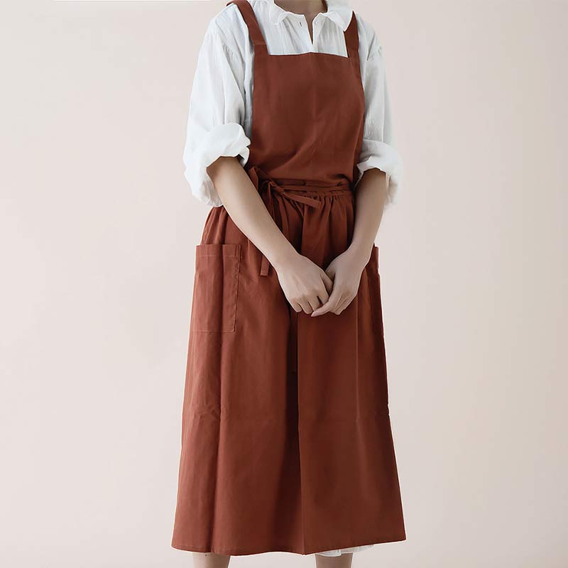 Classic black waterproof cotton kitchen apron, unisex, with useful front pockets.