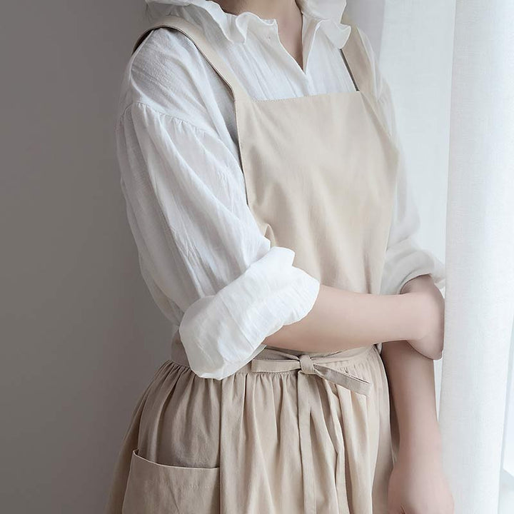 Burgundy waterproof cotton cooking apron, unisex, great for baking, with handy pockets.
