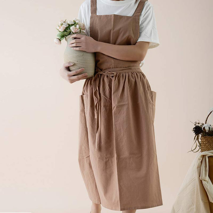 Khaki durable waterproof cotton apron, unisex, with adjustable straps & tool pockets.
