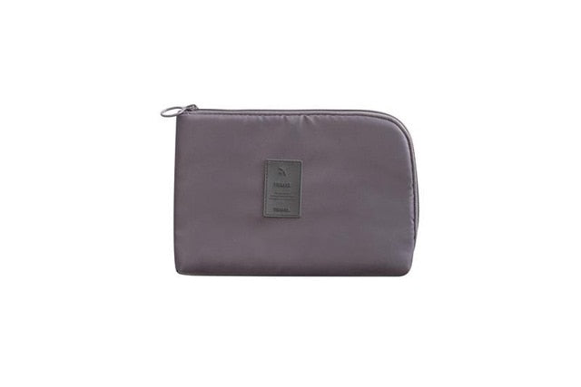 Waterproof gadget travel organizer, side view highlighting its slim profile
