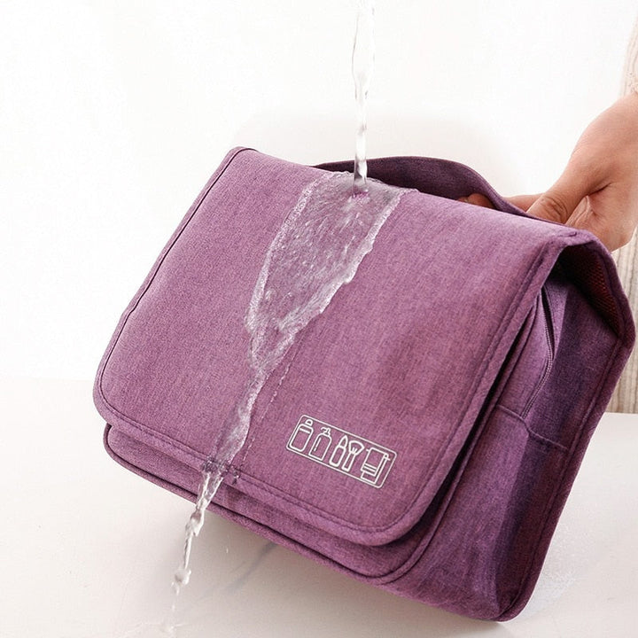Unisex hanging toiletry organizer, shown with various travel-sized bottles and personal items inside.