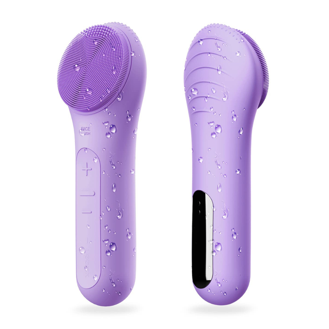 Person using a unisex waterproof rechargeable facial cleansing brush for a gentle face massage and exfoliation.