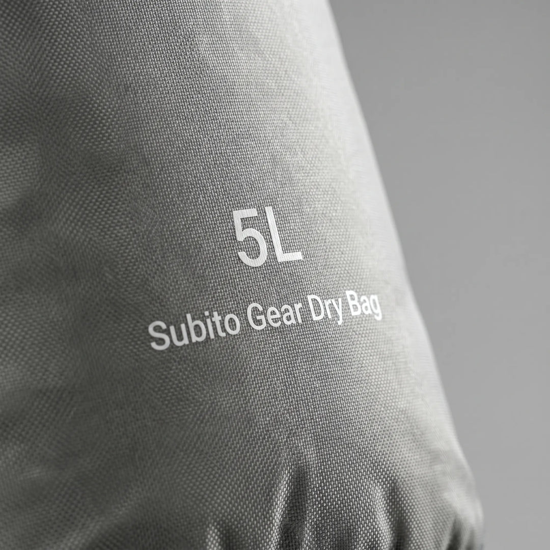 Lightweight waterproof storage sack with roll-top closure, essential for camping, hiking & travel.