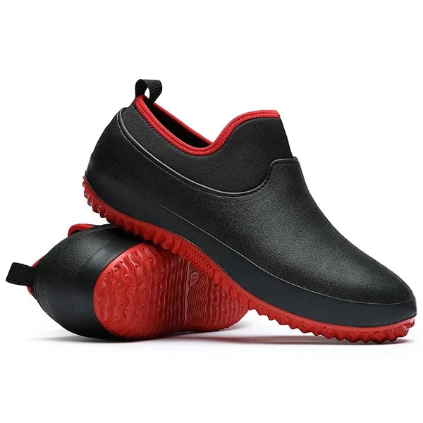 Unisex waterproof slip-on work shoes, non-slip outsole, black, for safety & all-day comfort in industrial settings.