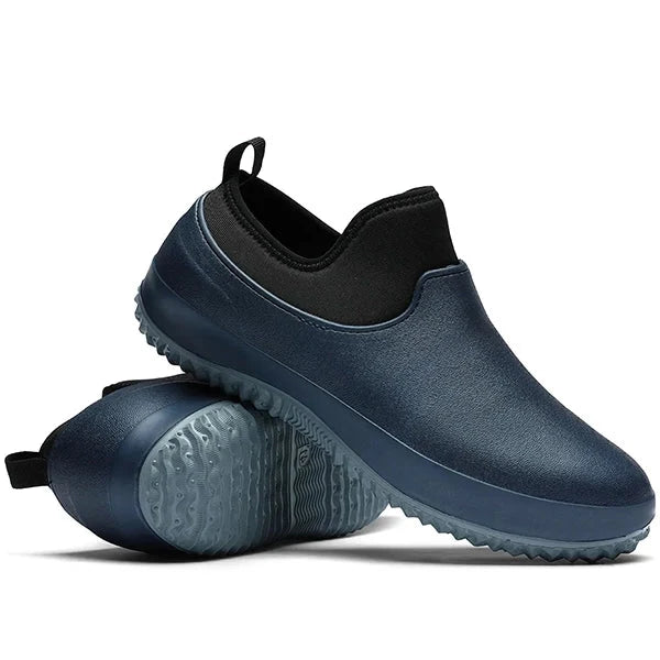 Comfortable unisex black slip-on work shoes, waterproof design, perfect durable industrial footwear for long shifts.