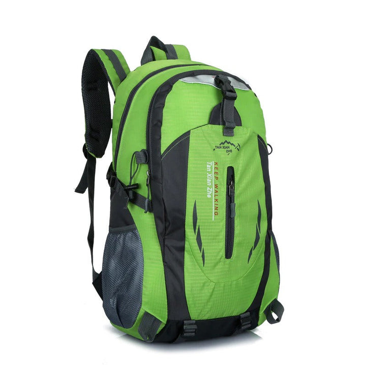 Unisex waterproof travel backpack carried on a scenic trail. Ideal hiking gear for all outdoor adventures and camping trips.