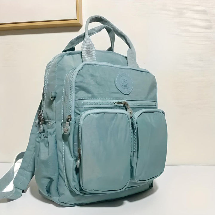 Modern unisex urban backpack featuring a waterproof design & numerous multi-pockets for organized travel.