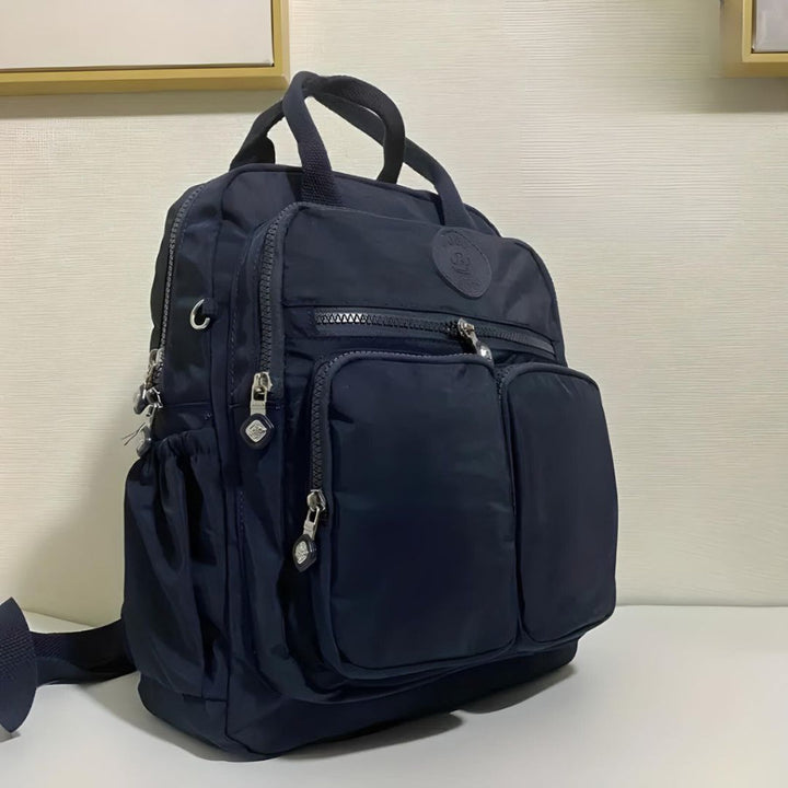 Commuter-friendly unisex urban backpack. Waterproof fabric protects essentials in multiple organized pockets.