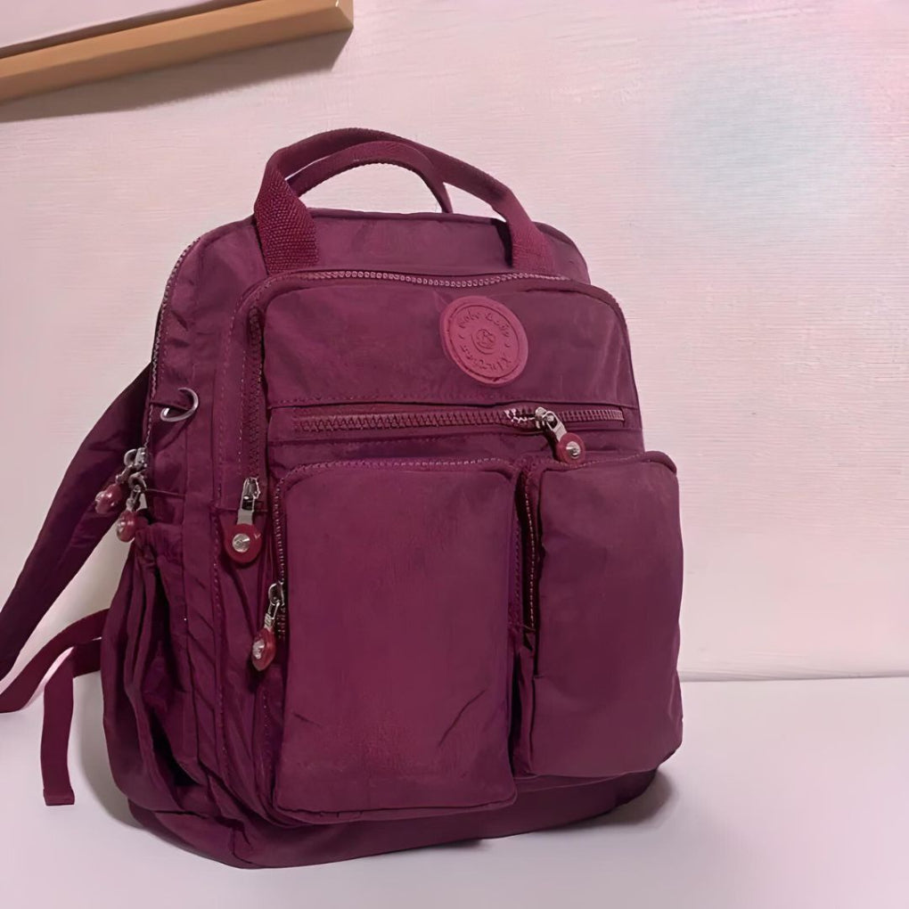 Stylish waterproof urban backpack. Unisex, multiple pockets, perfect for school, work, or travel.