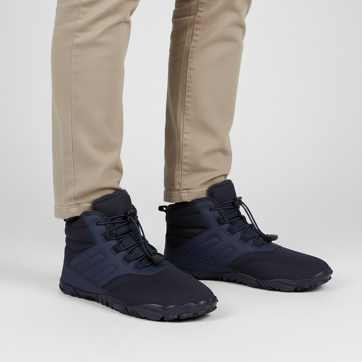 Action shot of Isaac unisex winter boots on snowy terrain, highlighting anti-slip and warmth features
