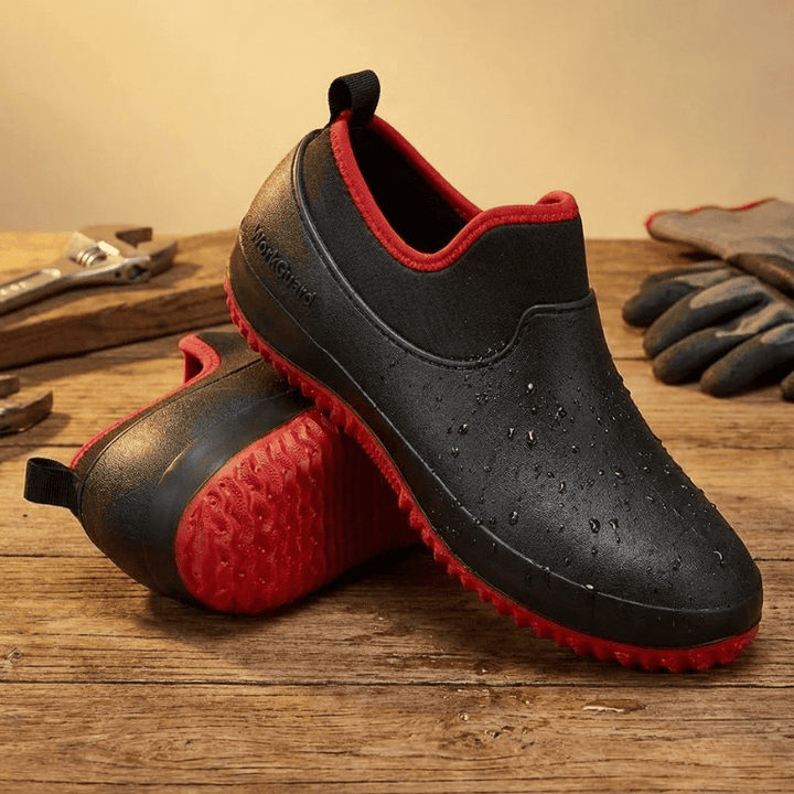 Unisex waterproof work shoes with all-weather grip, ideal for construction & industrial settings.