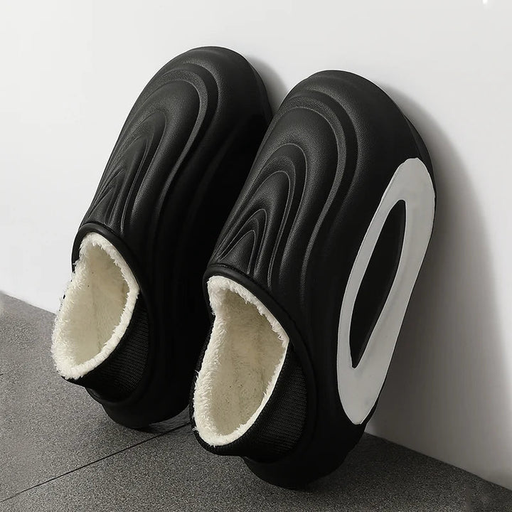 Easy slip-on unisex wave fleece slides, cushioned & comfortable, perfect casual modern footwear.