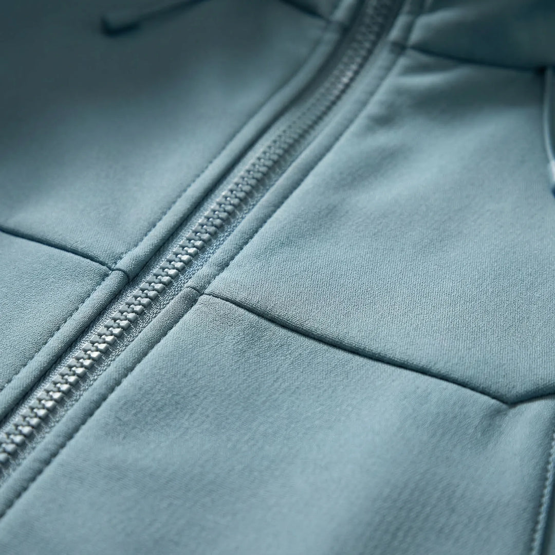 Durable weather-resistant hooded jacket, suitable for hiking, camping, and travel.