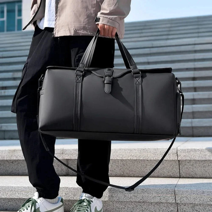 Unisex weekend duffle bag with spacious interior for travel essentials and accessories.