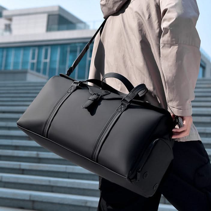 Stylish carry-on duffle bag, perfect for weekend trips, featuring durable design and ample space.