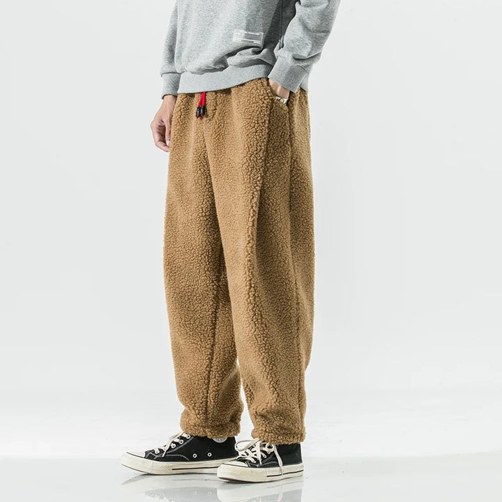 Soft unisex jogger style sweatpants for relaxed lounging, comfortable casual wear, ideal for weekend activities.