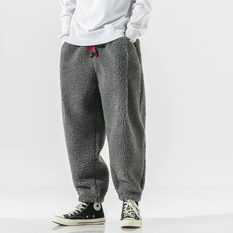 Unisex Weekender Sweatpants in black, comfortable drawstring waist, relaxed fit for ultimate loungewear comfort.