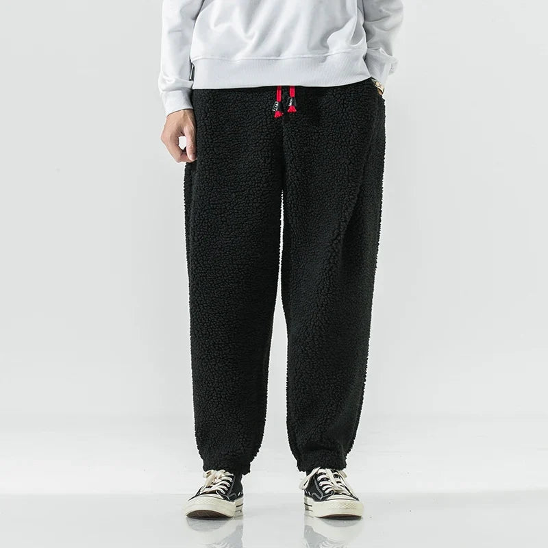 Gray unisex jogger sweatpants, cozy bottoms for relaxed lounging & casual everyday wear, perfect for comfort.