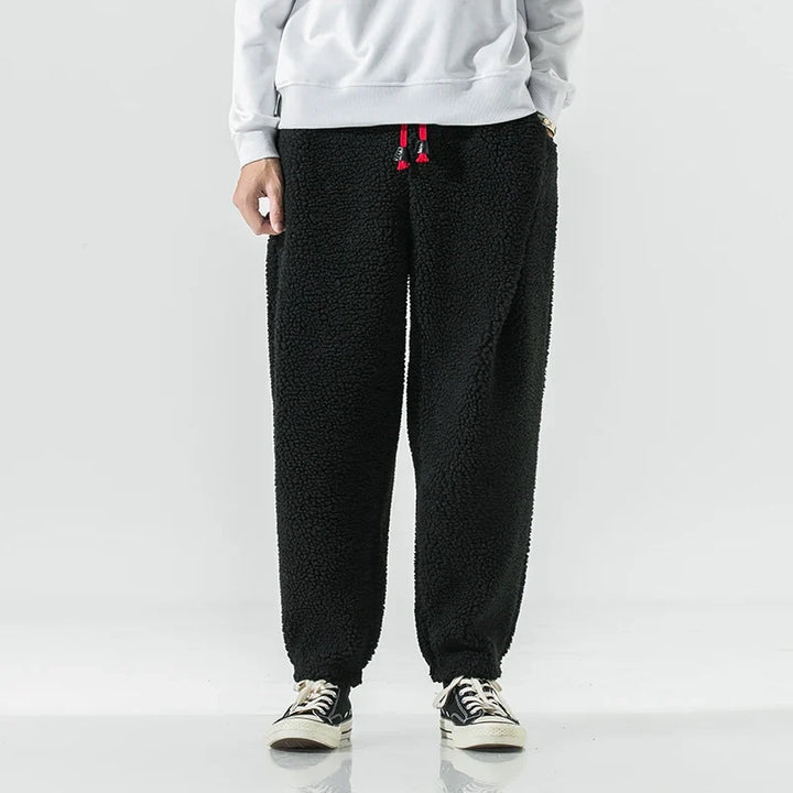 Gray unisex jogger sweatpants, cozy bottoms for relaxed lounging & casual everyday wear, perfect for comfort.