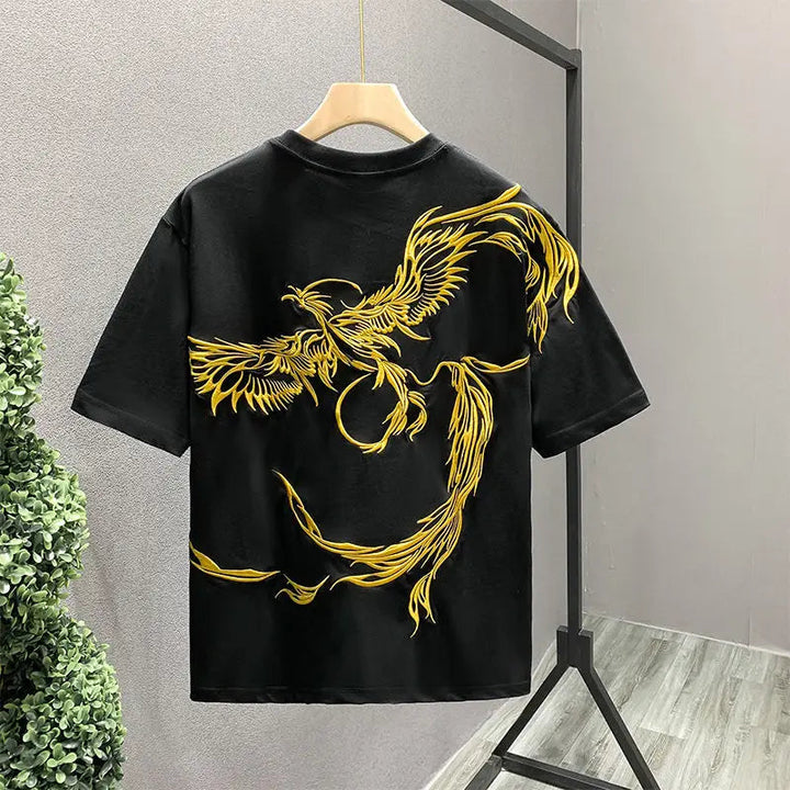Statement unisex t-shirt featuring a vibrant phoenix embroidery. Soft cotton for a comfortable, unique graphic tee.