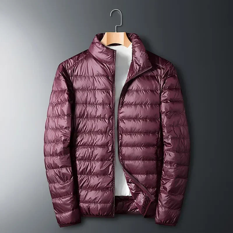 Warm white packable unisex winter jacket. Lightweight, waterproof, & durable cold weather outerwear for daily use.