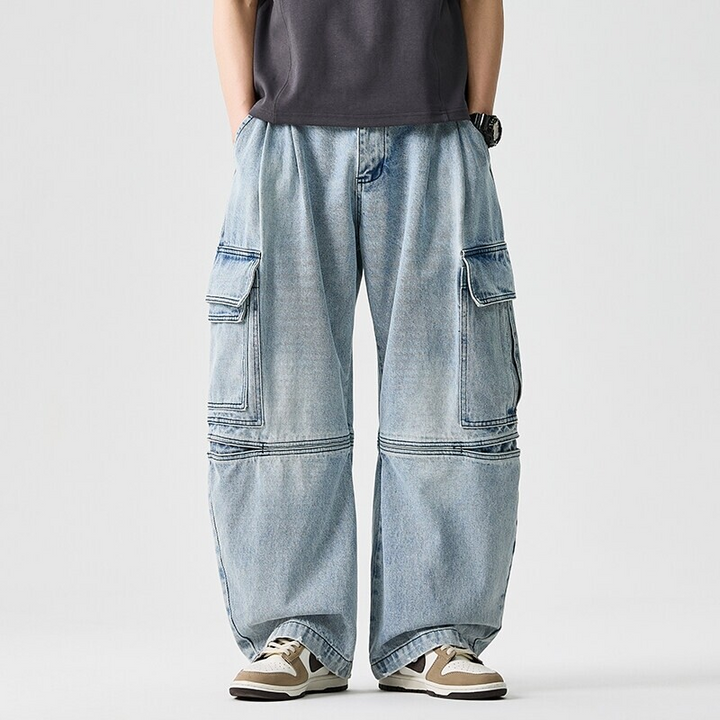 Model wearing comfortable unisex wide-leg denim pants, showcasing relaxed fit, utility pockets, & streetwear style.