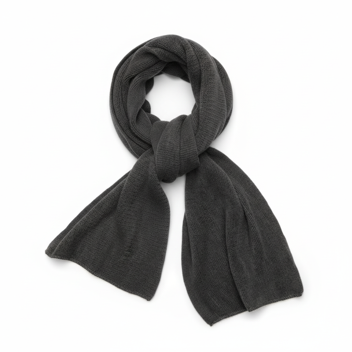 Close-up of the woven detail of a warm cashmere scarf, highlighting its luxurious feel and quality