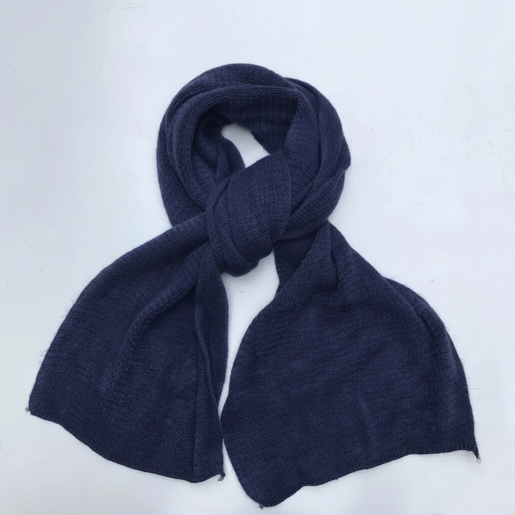 A person wearing a cozy beige cashmere scarf, demonstrating its soft and warm qualities in winter