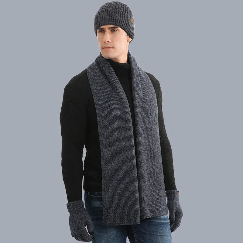 Soft gray knitted hat, scarf, and gloves set, essential unisex winter accessories.