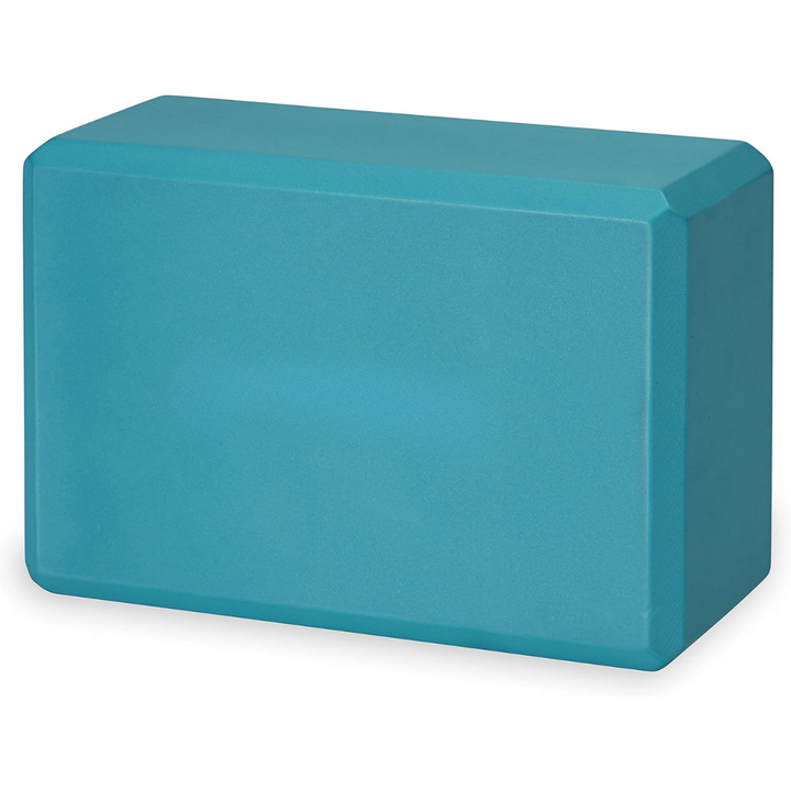 Premium non-slip EVA foam yoga block beside a mat and strap, essential accessories for complete fitness practice.