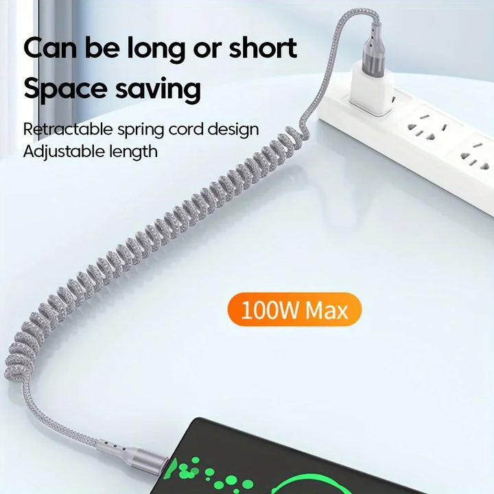 Two Universal 100W USB-C spring fast charging cables, black coiled, against tech background
