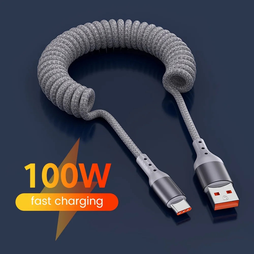 Hand holding 100W USB-C spring fast charging cable, demonstrating compact size