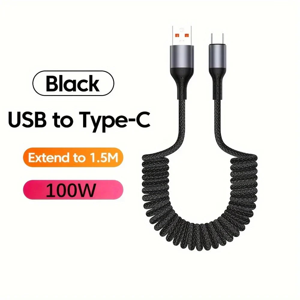 Coiled 100W USB-C charging cable laid out, highlighting spring tension and durability