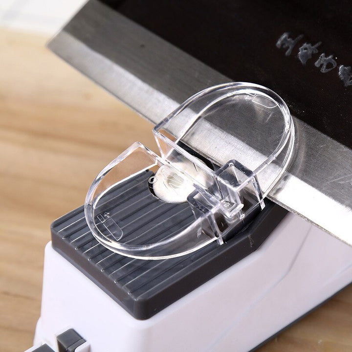 Electric sharpener for knives and scissors, a versatile kitchen tool for blade maintenance.