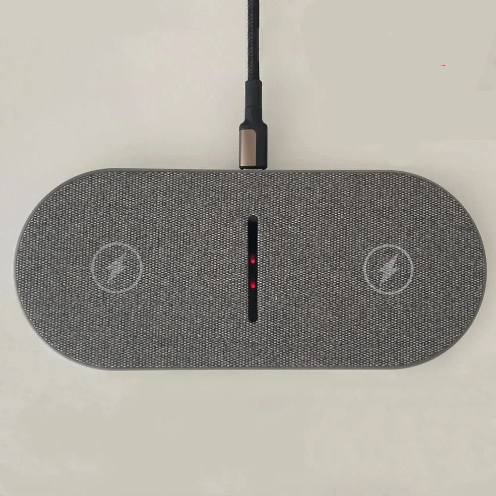 Convenient dual fast wireless charging station. Qi-compatible tech accessory for phones & earbuds, declutters desks.
