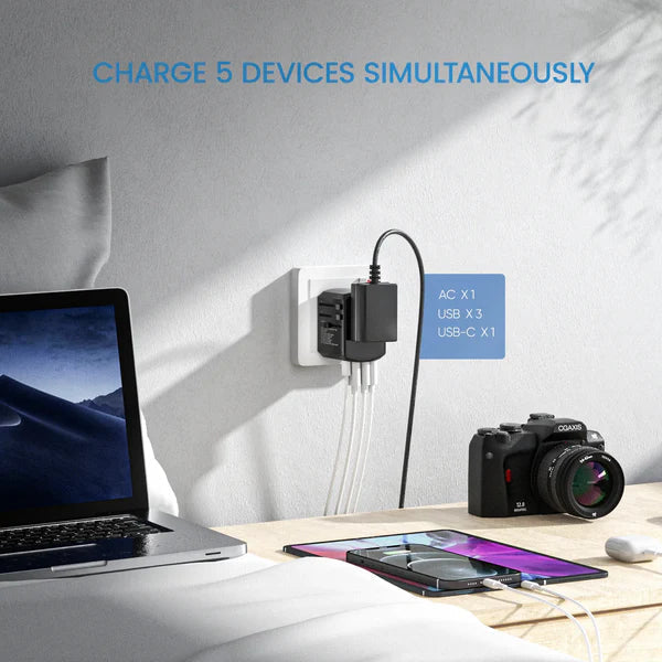 Universal travel power adapter displaying various international plugs: EU, UK, US, AU. All-in-one global USB charger.