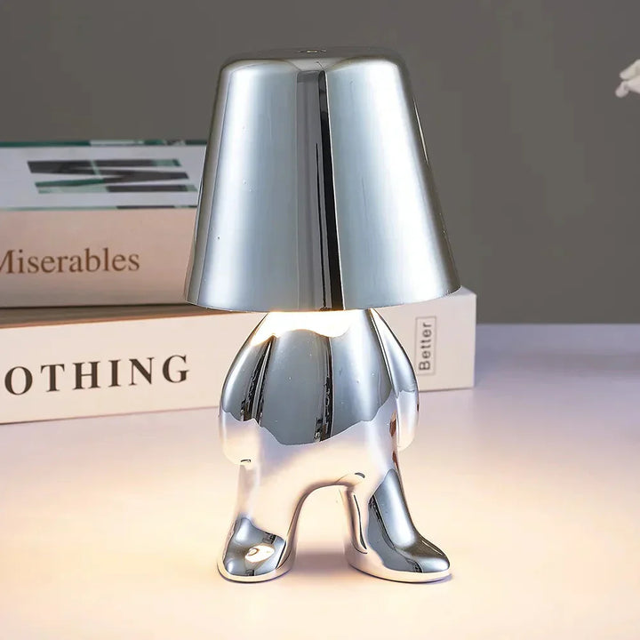Compact LED table lamp, rechargeable, minimalist design for modern living spaces