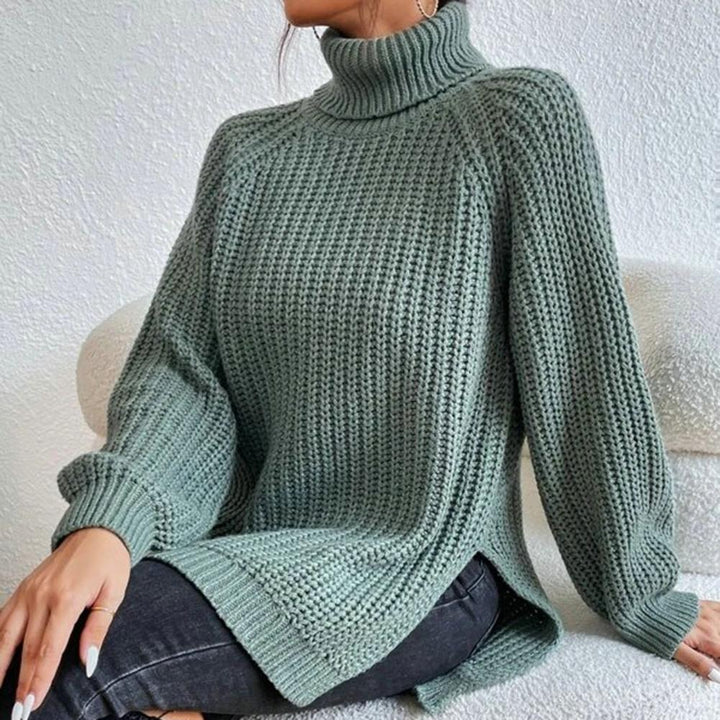 Chic women's winter roll neck sweater. Velmora long sleeve knit jumper, offering cozy warmth and fashion appeal.