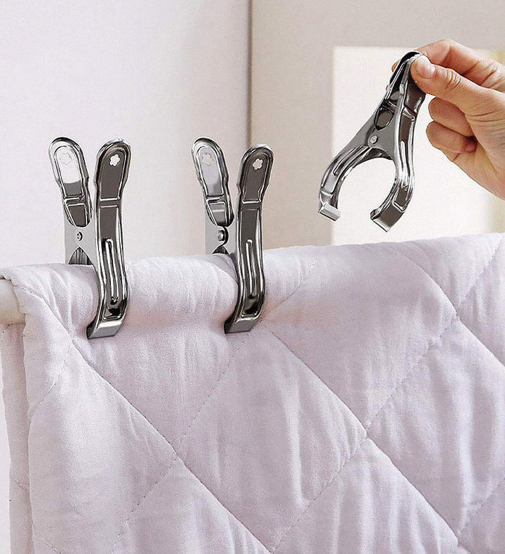 Set of 4 Veltrix extra large stainless steel non-slip towel clips for secure outdoor use